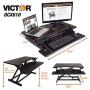 Victor DCX610 Height Adjustable Compact Standing Desk| Black| 33” Wide Sit-Stand Dual Monitor Desk and Laptop Riser Workstation| Compatible with Most Monitor Arms